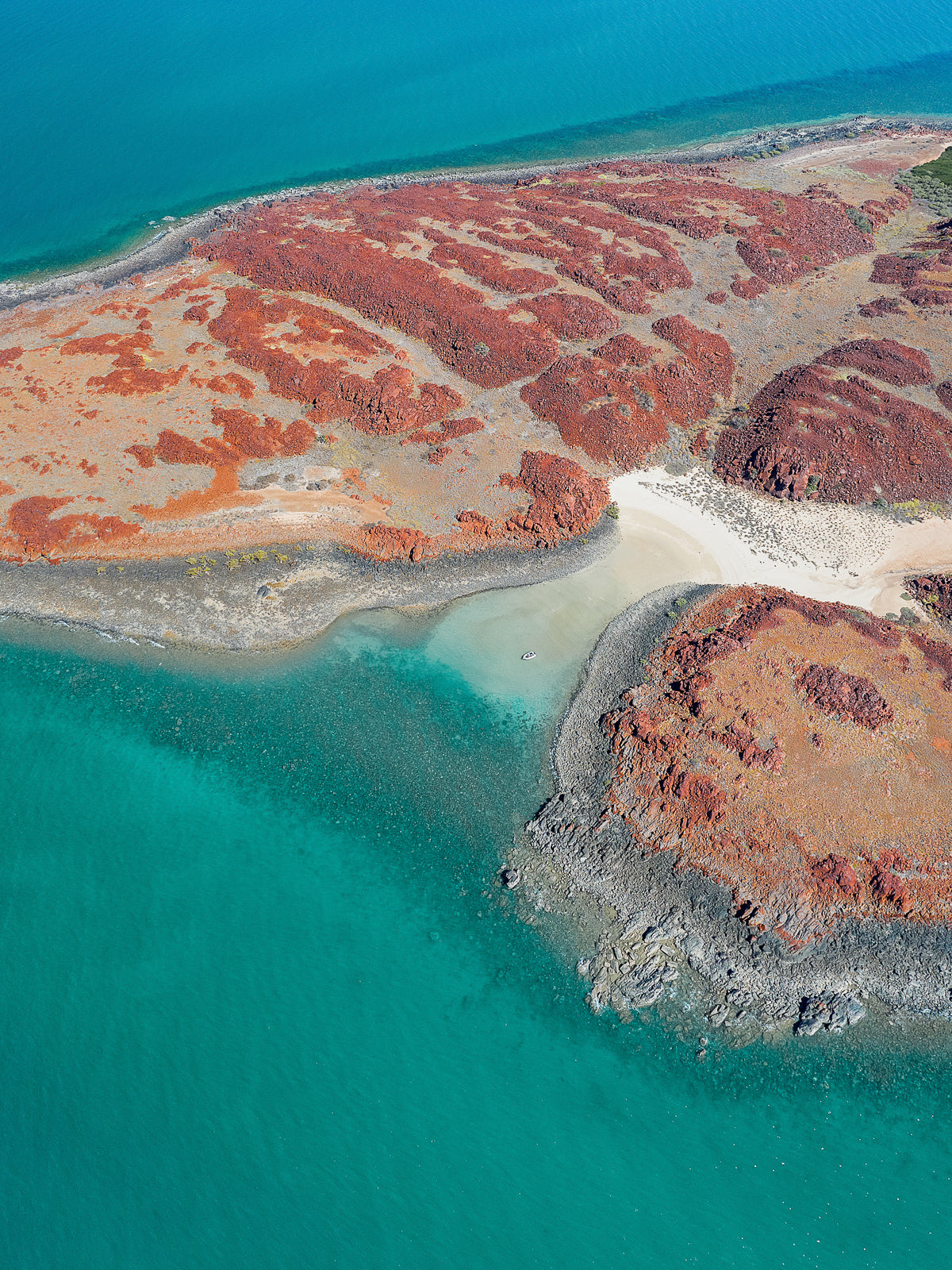 Boat anchored in pirates cove, dampier archipelago, western australia